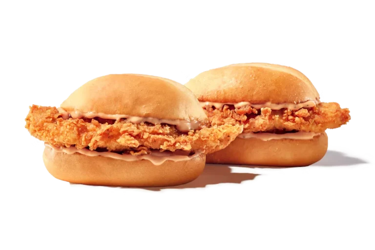 Zaxby's 2 Nibblerz® – Two hand-breaded Chicken Fingerz™ with Zax Sauce® on toasted buns.