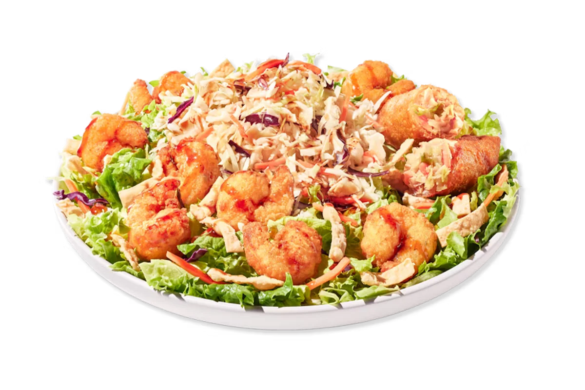 Zaxby’s Asian Zensation Zalad™ with Southern Fried Shrimp topped with crispy wonton strips, served with citrus vinaigrette and an egg roll on the side.