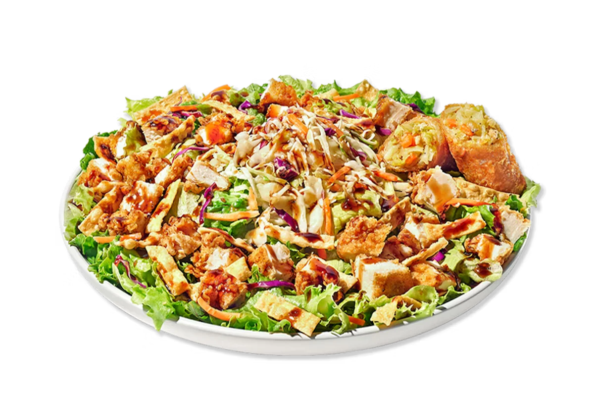Zaxby’s Asian Zensation Zalad™ featuring hand-breaded chicken, freshly chopped greens, crispy wonton strips, red cabbage, carrots, and Asian-style dressing with a citrus vinaigrette.