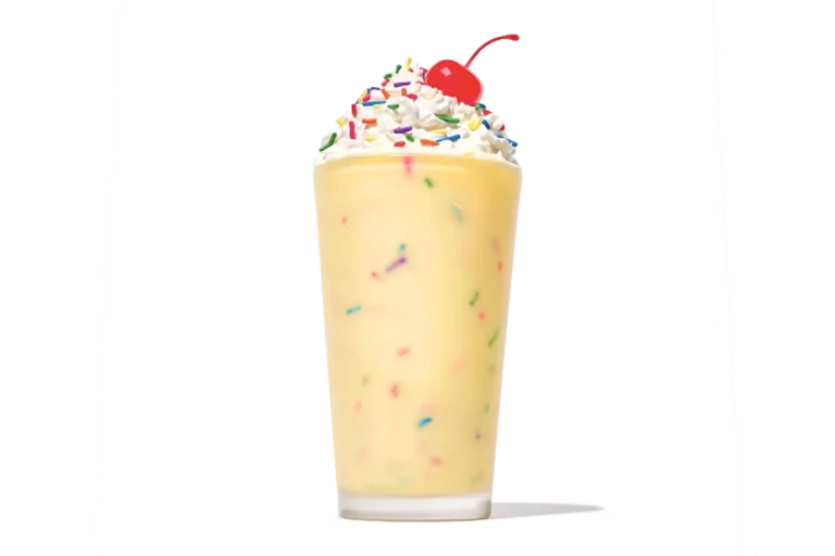 Zaxby's Birthday Cake Milkshake, a creamy milkshake topped with whipped cream, sprinkles, and a sweet birthday cake flavor.