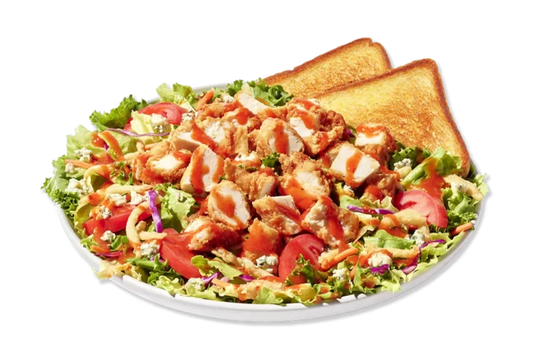 Zaxby’s Blue Zalad featuring hand-breaded chicken or grilled chicken, mixed greens, Roma tomatoes, blue cheese crumbles, and fried onion strips.