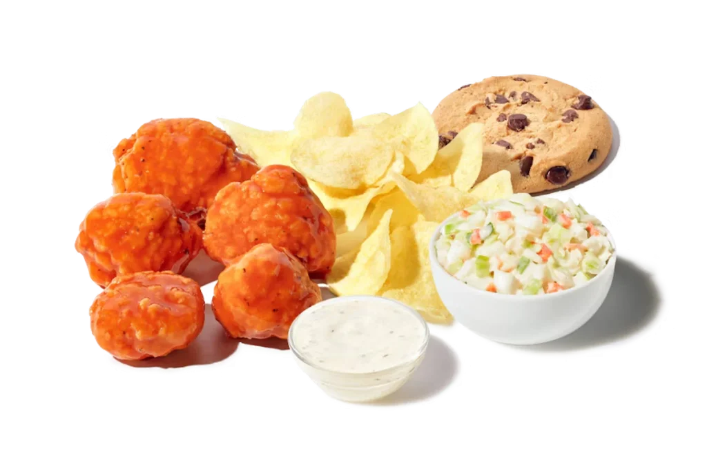 Zaxby's Boneless Wings Boxed Lunch, featuring 5 boneless wings tossed in your choice of sauce, served with Ranch dipping sauce, chips, cole slaw, and a chocolate chip cookie.