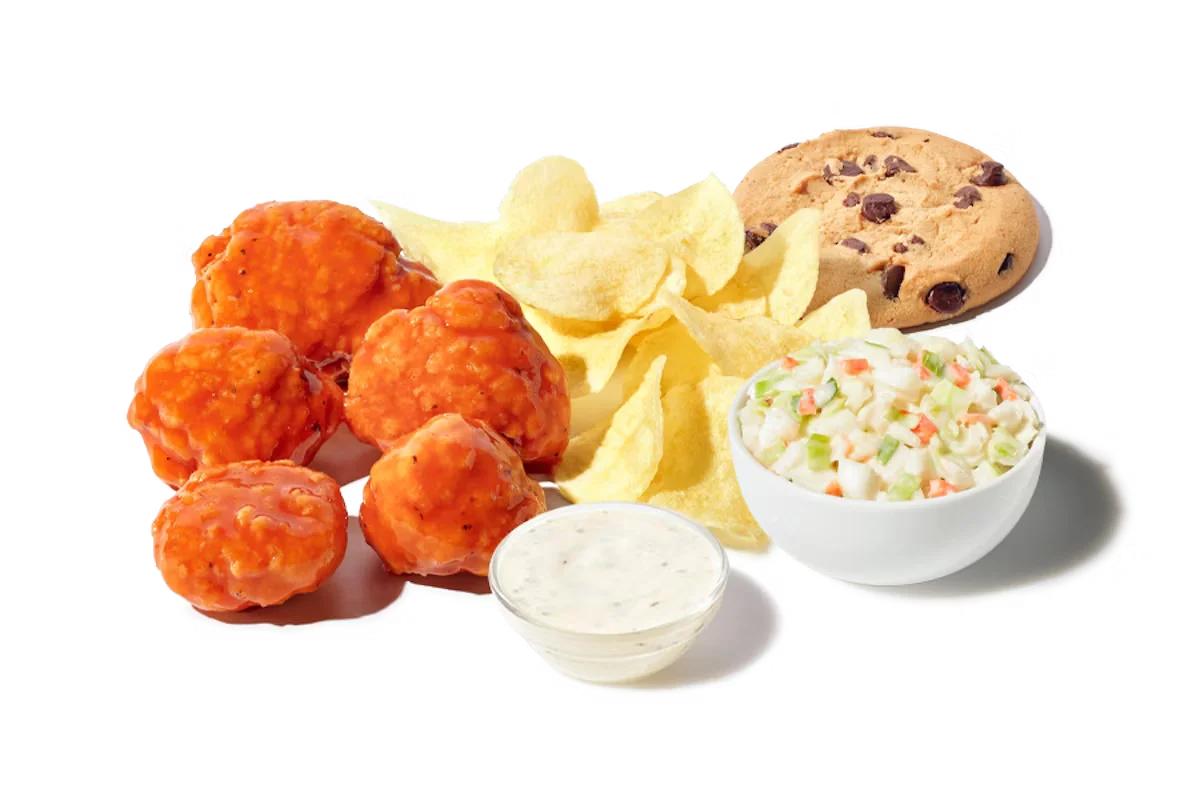 Zaxby's Boneless Wings Boxed Lunch, featuring 5 boneless wings tossed in your choice of sauce, served with Ranch dipping sauce, chips, cole slaw, and a chocolate chip cookie.