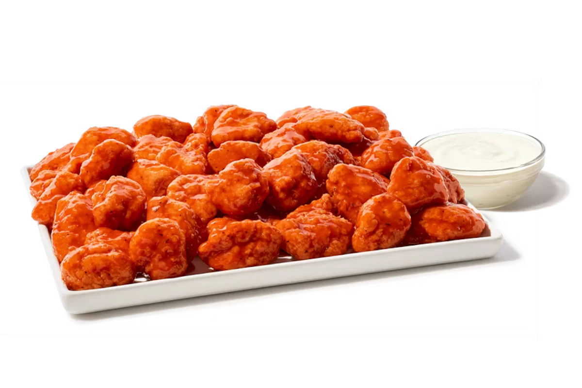Zaxby's Boneless Wings Platter, featuring 60 boneless wings tossed in your choice of sauce, served with Ranch dipping sauce.