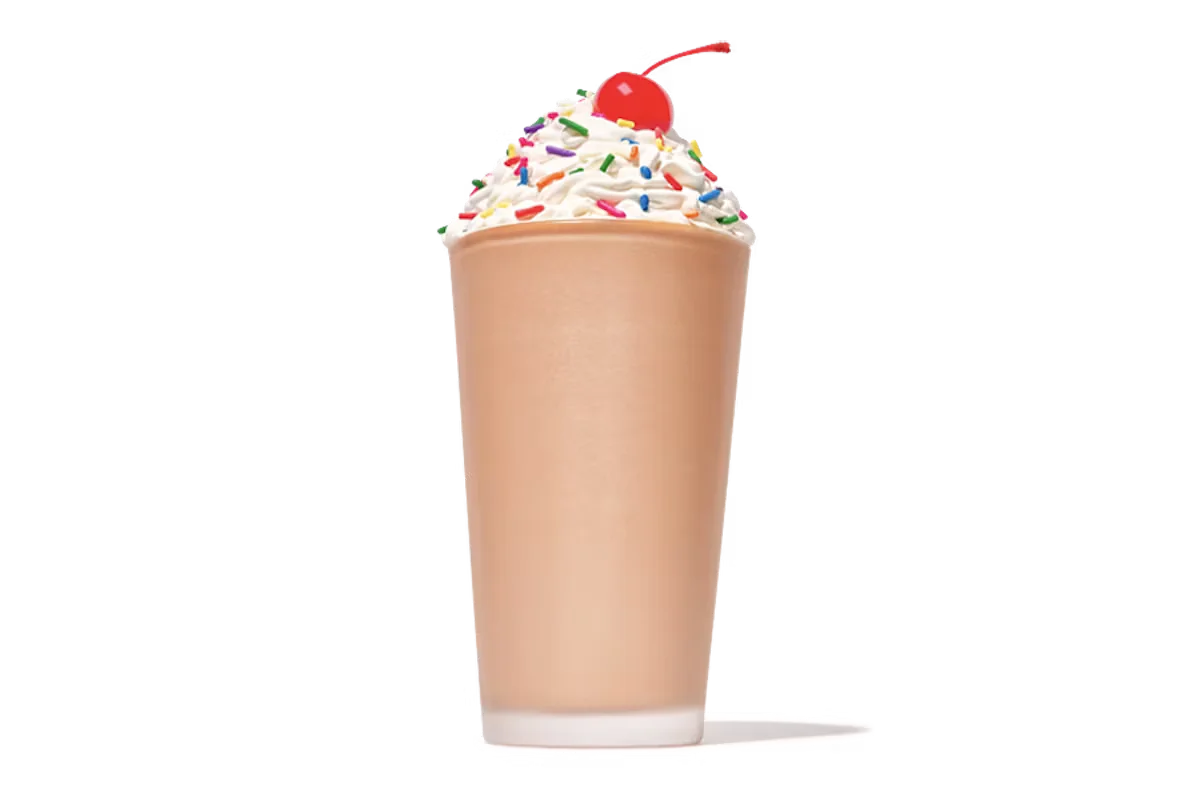 Zaxby's Chocolate Milkshake, a creamy milkshake blended with rich chocolate flavor, topped with whipped cream and a chocolate drizzle.