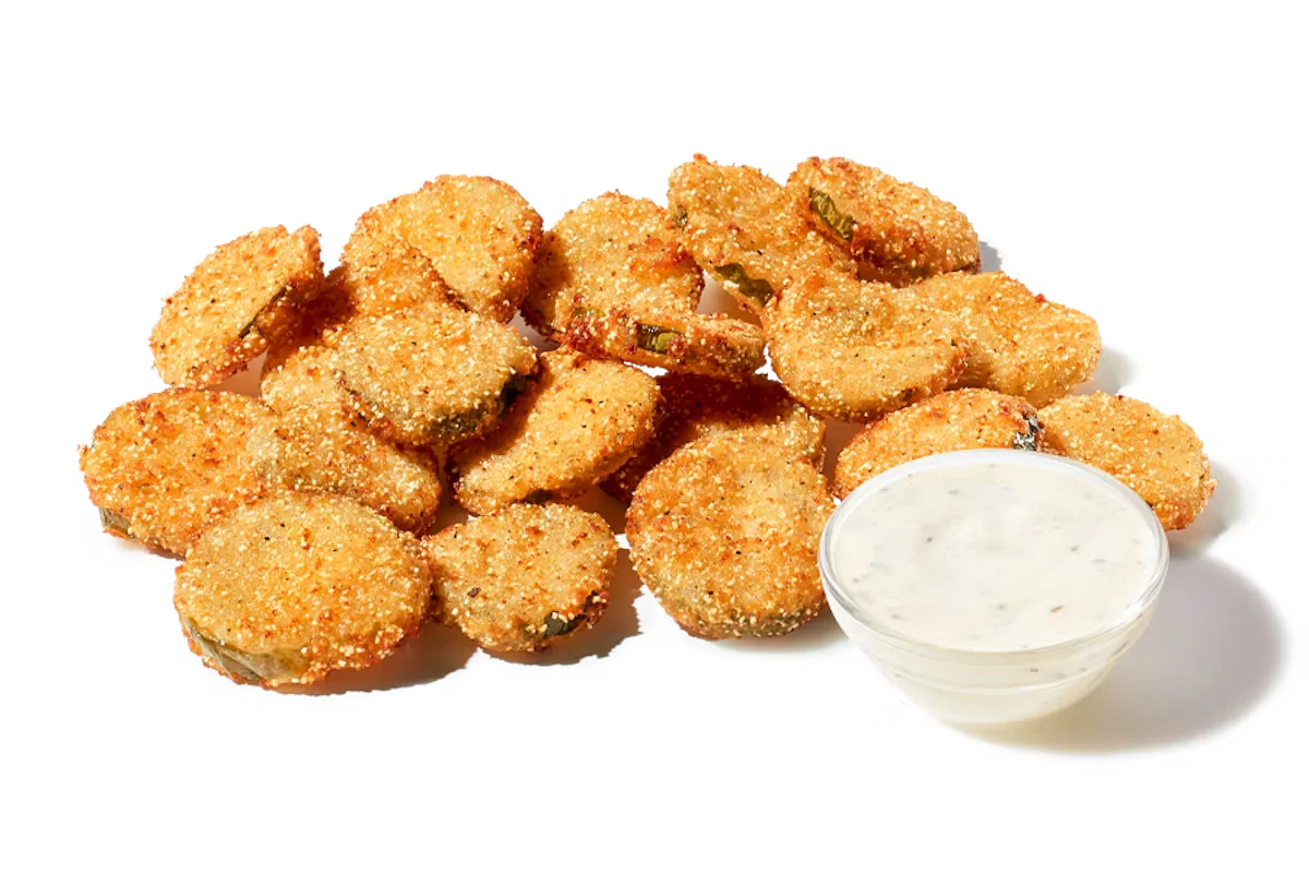 Zaxby's Fried Pickles, featuring crispy, battered pickle slices served with a side of ranch dipping sauce.