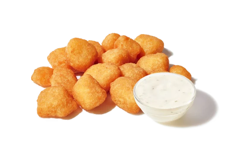 Zaxby's Fried White Cheddar Bites, featuring crispy, batter-dipped white cheddar cheese pieces served with ranch dipping sauce.