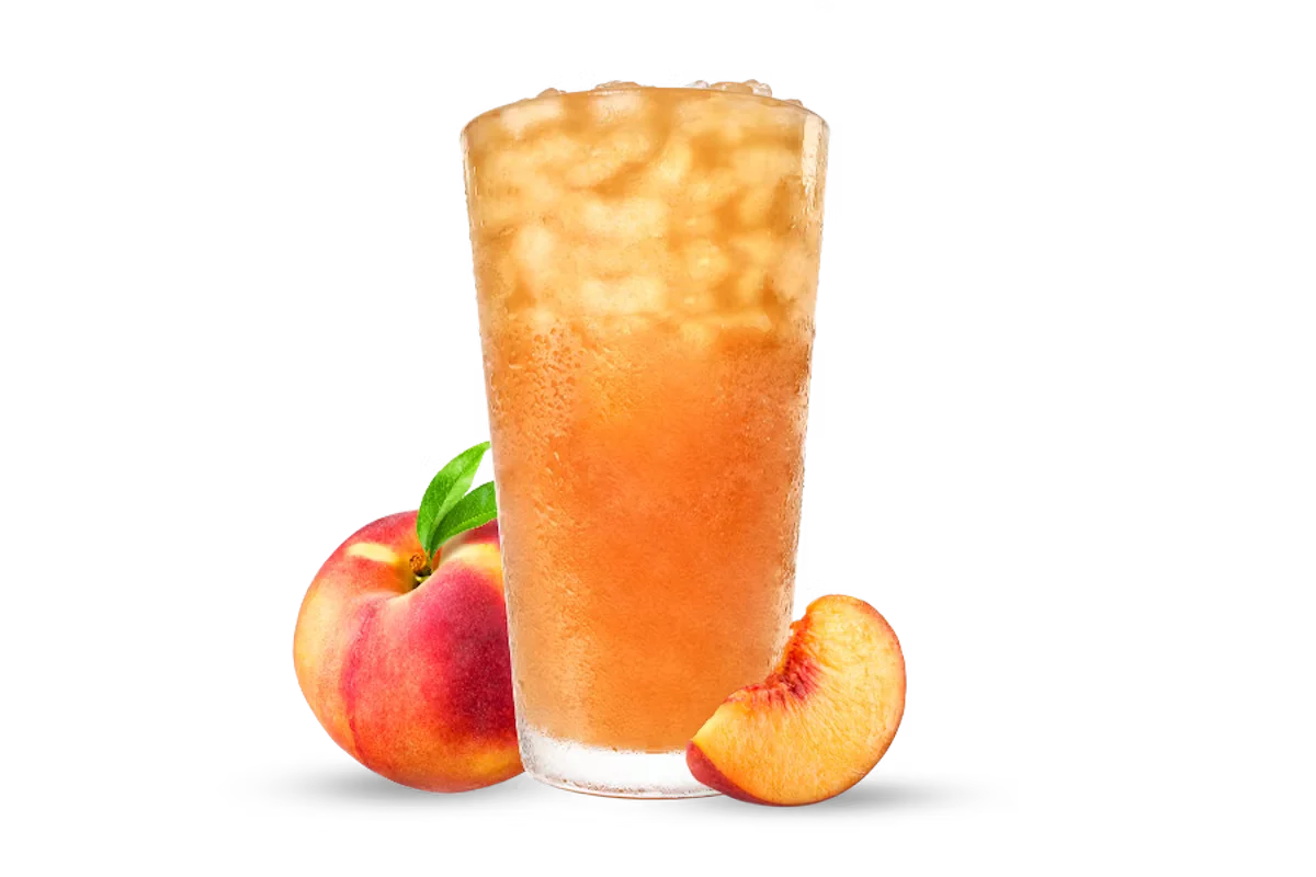Zaxby's Handcrafted Peach Sweet Tea, a sweet iced tea infused with peach flavor, served ice-cold for a refreshing drink.