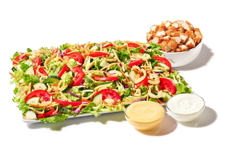 Zaxby’s House Zalad® Platter served with hand-breaded Chicken Fingerz™, mixed greens, cucumbers, tomatoes, shredded cheese, and crispy fried onions.