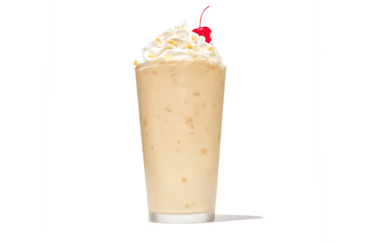 Zaxby's Salted Caramel Milkshake, a creamy milkshake topped with whipped cream and a caramel drizzle for a sweet, indulgent treat.
