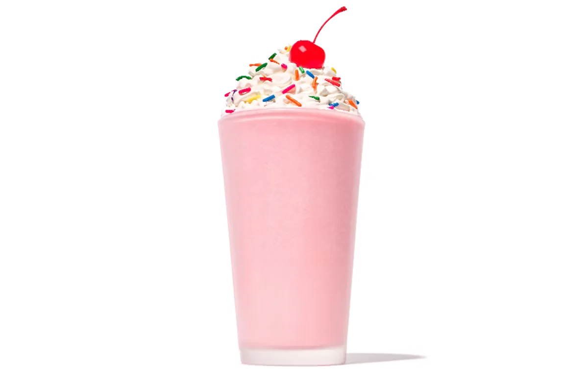 Zaxby's Strawberry Milkshake, a creamy milkshake blended with fresh strawberry flavor, topped with whipped cream and a strawberry drizzle.