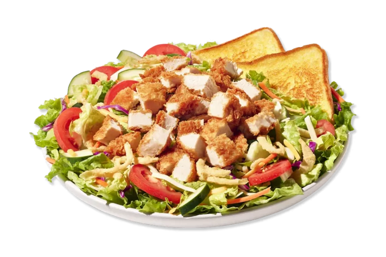 Zaxby’s House Zalad® with grilled or fried chicken on mixed greens, topped with tomatoes, cucumbers, cheese, and fried onions.