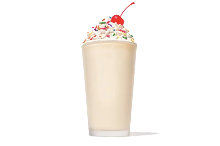 Zaxby's Vanilla Milkshake, a creamy milkshake blended with rich vanilla flavor, topped with whipped cream and a vanilla drizzle.
