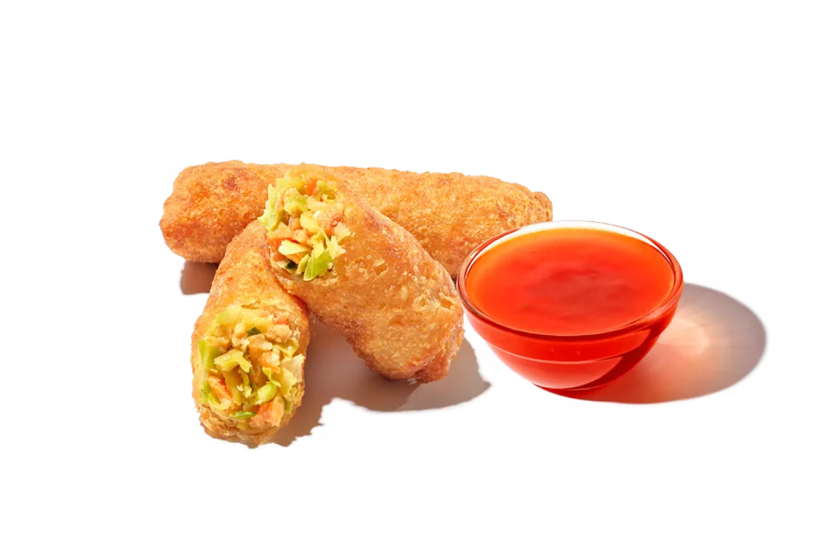 Zaxby's Veggie Egg Rolls, featuring crispy egg rolls filled with seasoned vegetables, served with dipping sauce.