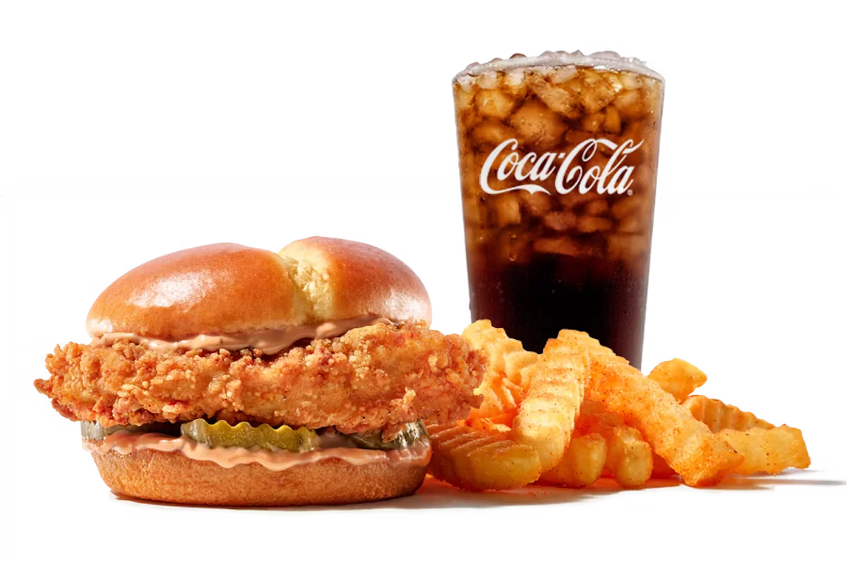 Zaxby's™ Signature Sandwich, featuring a crispy chicken fillet, pickles, and mayo on a toasted bun.